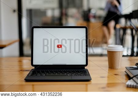 Chiang Mai, Thailand - Aug 26, 2021 : Woman Using A Tablet To Connect To Youtube Premium. Youtube Is