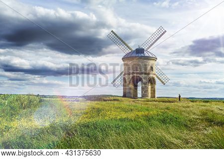 Sun Glare And Unrecognisable Little Boy Using Phone. Chesterton Windmill In Leamington Spa, Warwicks