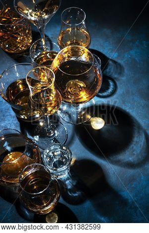 Strong Alcohol Drinks, Hard Liquors, Spirits And Distillates Iset In Glasses: Cognac, Scotch, Whiske