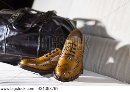 Footwear Concepts. Male Tanned Full Broggued Oxford Calf Leather Shoes Along With Dark Brown Leather
