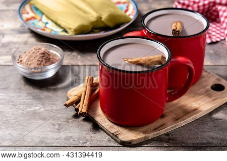 Traditional Mexican Chocolate Atole Drink On Rustic Wooden Table