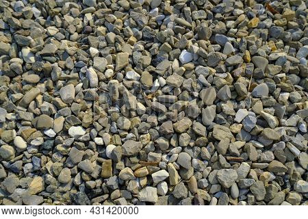 Background Of Breakstone Close-up. Natural Industrial Background. Pebblestone