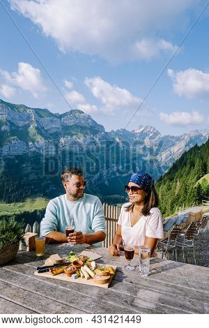 Swiss Alps And A Mountain Restaurant Under The Aescher Cliff Viewed From Mountain Ebenalp In The App