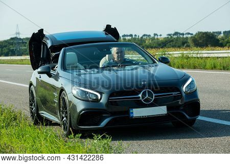 Dnepropetrovsk, Ukraine - 08.24.2021: Photos Of A Mercedes Benz Sl550 Convertible On The Road. Conve