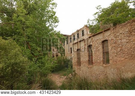 Old Abandoned Factory In The Riverbed In Banyeres Of Mariola, Alicante, Spain.