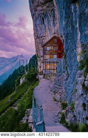 Swiss Alps And A Mountain Restaurant Under The Aescher Cliff Viewed From Mountain Ebenalp In The App