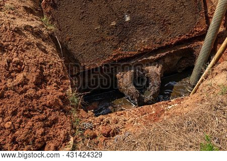 Open Septic Tank Being Pumped Of Sewage Sludge, Dirty Jobs Outdoors, Horizontal Aspect