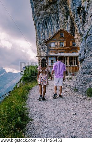Swiss Alps And A Mountain Restaurant Under The Aescher Cliff Viewed From Mountain Ebenalp In The App