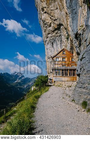 Swiss Alps And A Mountain Restaurant Under The Aescher Cliff Viewed From Mountain Ebenalp In The App