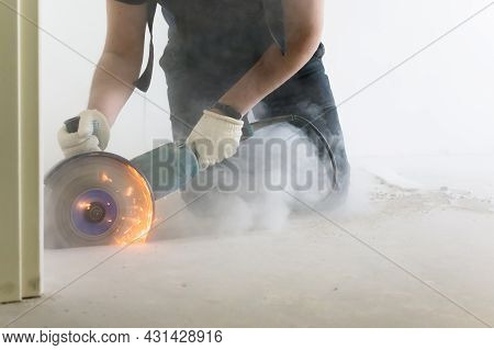 Cutting Concrete Floor Screed Bolarka Man In Construction Combenizon And Work Gloves. Power Tools. F