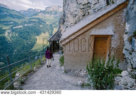Swiss Alps And A Mountain Restaurant Under The Aescher Cliff Viewed From Mountain Ebenalp In The App