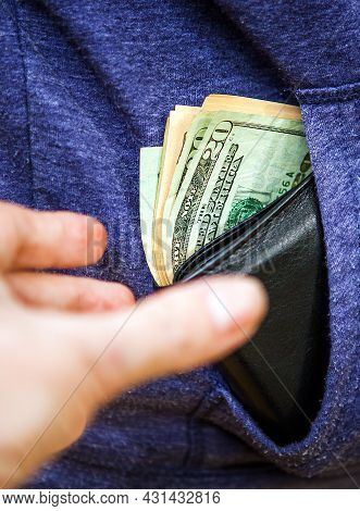 Person Steals A Wallet With A Money From A Pocket Outdoor