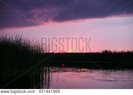 Late Evening Sunset Near River Lielupe, With Pink Colors And Cloudy. Photo Taken On A Warm Summer Da
