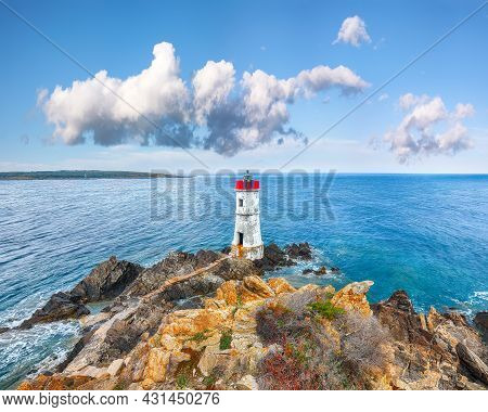 Fantastic Suny Day Over Capo Ferro Lighthouse. Popular Travel Destination Of Mediterranean Sea. Loca