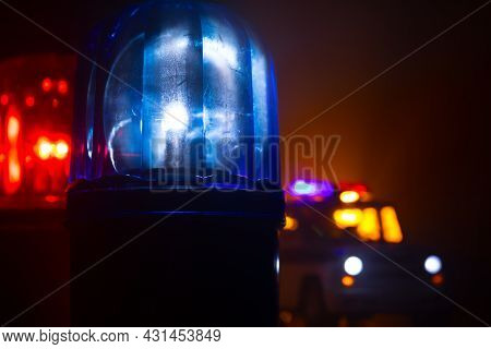 Police Car Blue And Red Round Vintage Siren In Dark. Rotating Retro Style Police Siren In Dark.