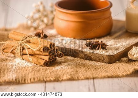 cinnamon sticks on wooden background