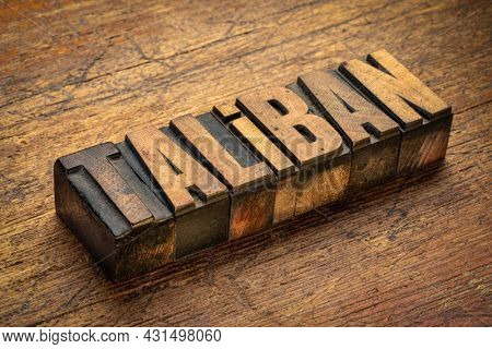 taliban word abstract in vintage letterpress wood type against grunge wood,  Afghanistan