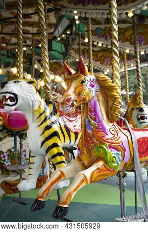 London, U.k., July 22,2021: Carousel Horse, Having Fun, Merry Go Ride At London Zoopark