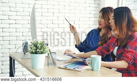 Asian Colleague Friendship At Work With Smiling Face. Happiness Two Women Colleague Working Together