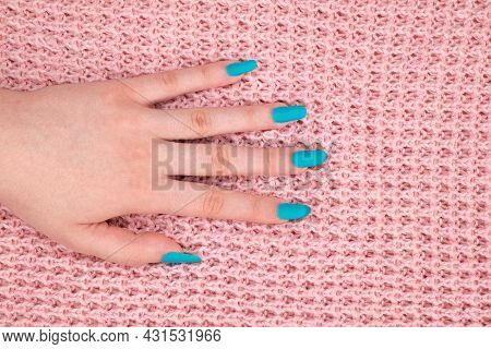 Girls Hand With Nailart On Sweater, Top View