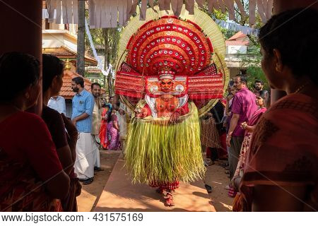 Payyanur, India - December 5, 2019: Theyyam perform during temple festival in Payyanur, Kerala, India. Theyyam is a popular ritual form of worship in Kerala, India
