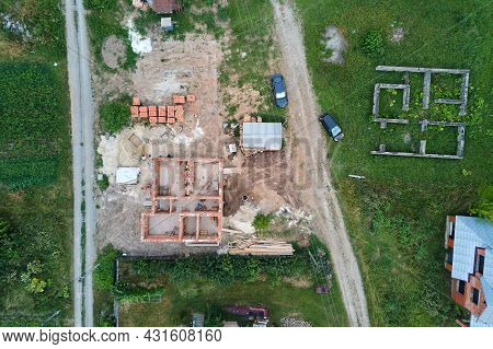 Top Down Aerial View Of Building Works Of New House Concrete Foundation On Construction Site.