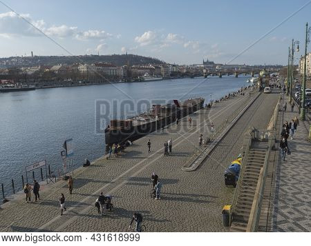 Prague, Czech Republic, March 26, 2021: The Embankment Of River Vltava Called Naplavka, With Crowd O