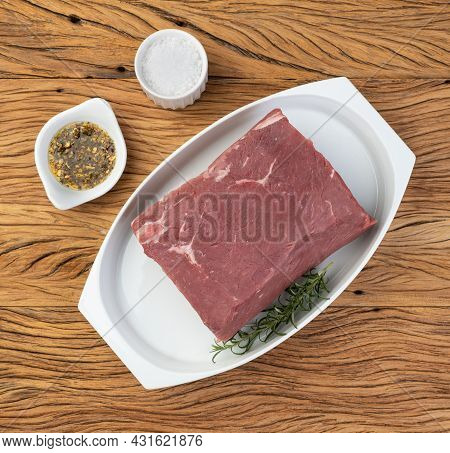 Raw Ancho Beef, Typical Argentinian Cut, Over White Plate With Seasonings.