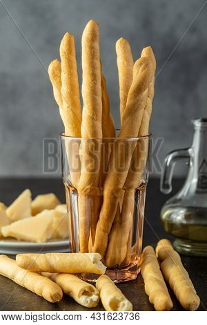 Grissini sticks. Traditional italian bread sticks on black table.