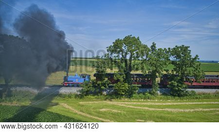 Ronks, Pennsylvania, June 2019 - Aerial View Of Thomas The Tank Engine Approaching Pulling Passenger