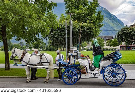 Switzerland, Interlaken, August 2021 - Horse Carriage Entertainment On Hoheweg Main Street \nin Cant