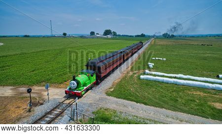 Ronks, Pennsylvania,june 2019 - Aerial View Of Percy The Tank Engine Approaching Thru Trees And Farm