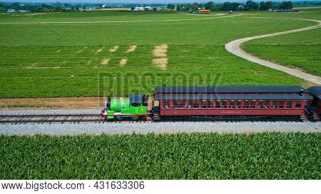 Ronks, Pennsylvania,june 2019 - Aerial View Of Percy The Tank Engine Approaching Thru Trees And Farm