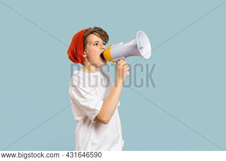 School Boy With Megaphone. Back To School Text