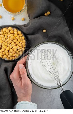Chickpea Aquafaba. Egg Replacement. Vegan Cooking Concept. Men Hands Whippe Whisk Chickpeas Liquid I