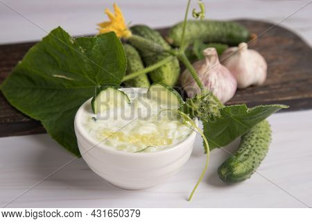 Greek Tzatziki Sauce Made Of Yogurt And Grated Cucumbers With Garlic. National Cuisines
