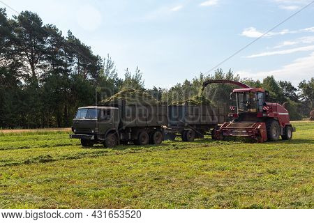 Combine Harvesting A Green Field