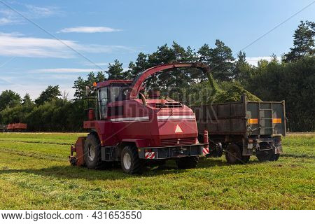 Combine Harvesting A Green Field