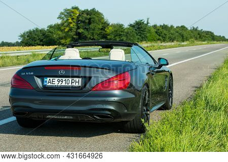 Dnepropetrovsk, Ukraine - 08.24. 2021: Photos Of The Mercedes Benz Sl550 Convertible On The Road.