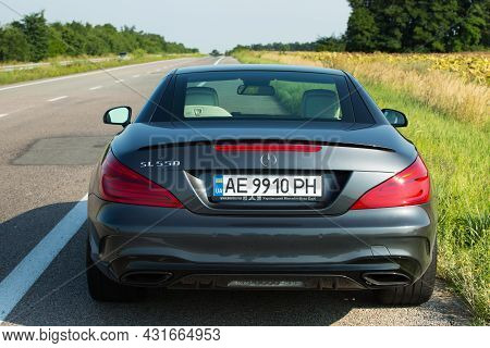Dnepropetrovsk, Ukraine - 08.24. 2021: Photos Of The Mercedes Benz Sl550 Convertible On The Road.