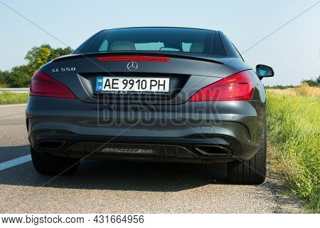 Dnepropetrovsk, Ukraine - 08.24. 2021: Photos Of The Mercedes Benz Sl550 Convertible On The Road.