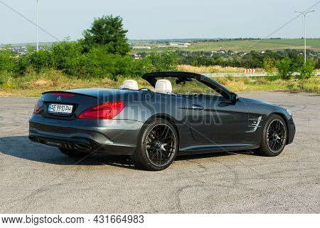 Dnepropetrovsk, Ukraine - 08.24. 2021: Photos Of The Mercedes Benz Sl550 Convertible On The Road.