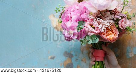 Woman holding a bouquet of flowers