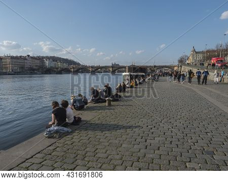 Prague, Czech Republic, March 26, 2021: The Embankment Of River Vltava Called Naplavka, With Crowd O