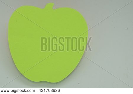 Green Apple Shaped Stick Note On White Background