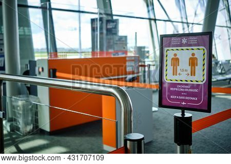 Sign In Warsaw Chopin Airport With Warning To Keep Social Distance Due To Covid 19 Pandemic In Warsa