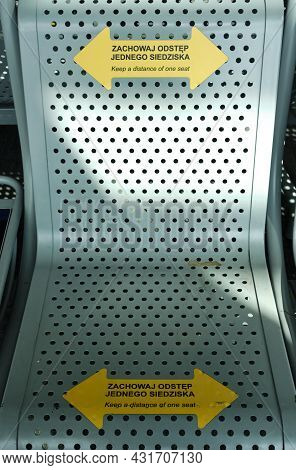 Seat In Warsaw Chopin Airport With Warnings To Keep Social Distance Due To Covid 19 Pandemic In Wars