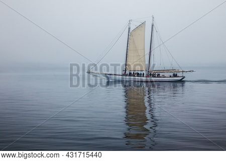 CAMPOBELLO ISLAND, NEW BRUNSWICK, CANADA - JULY 10, 2013: Schooner Ada C. Lore in fog near Campobello Island in Atlantic Ocean.
