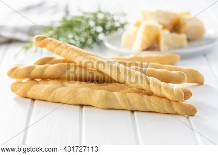 Grissini sticks. Traditional italian bread sticks on white table.