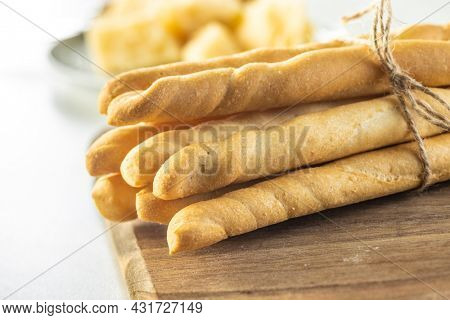 Grissini sticks. Traditional italian bread sticks on cutting board.